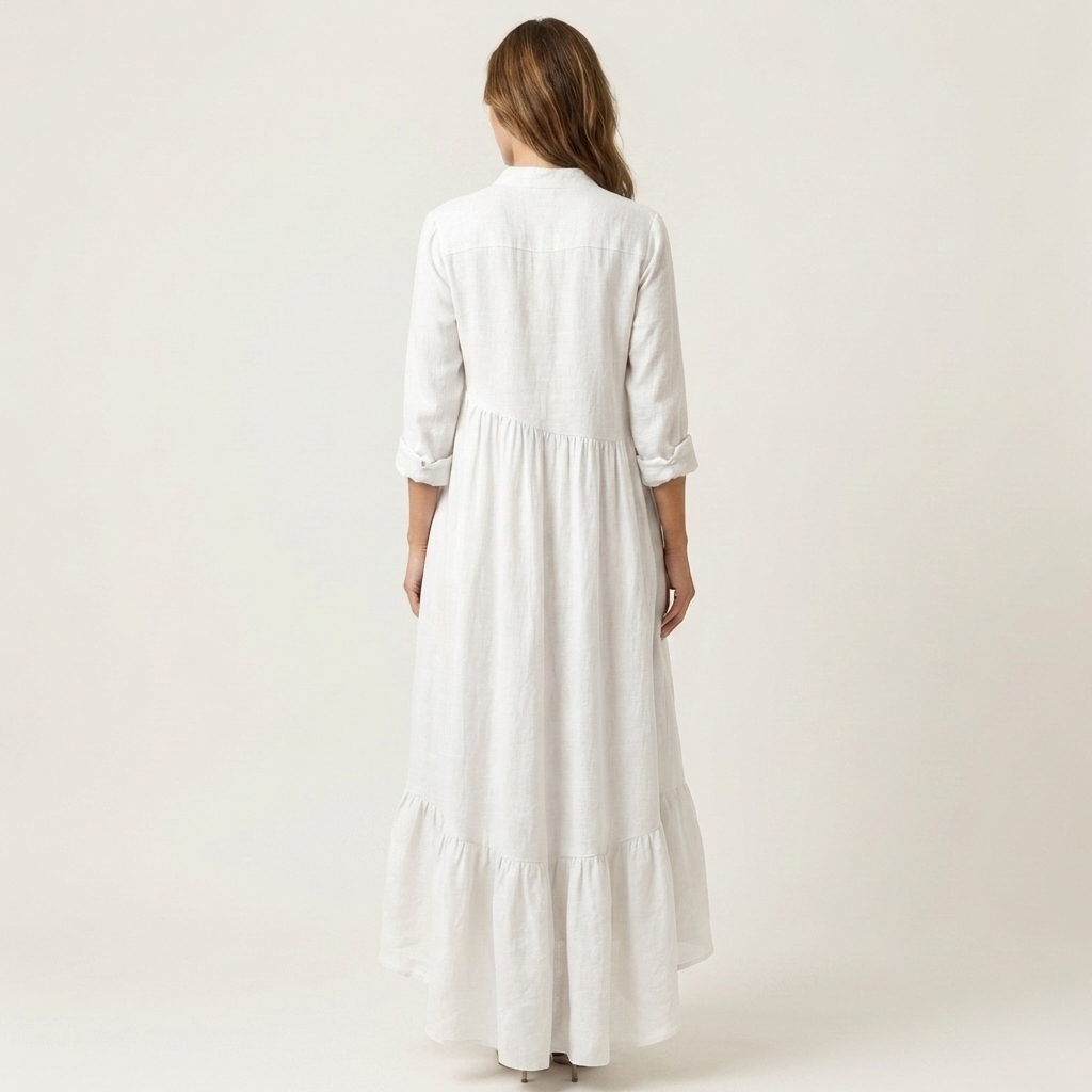 Jilana | Vestido largo con cuello alto, botones frontales y bajo de volantes